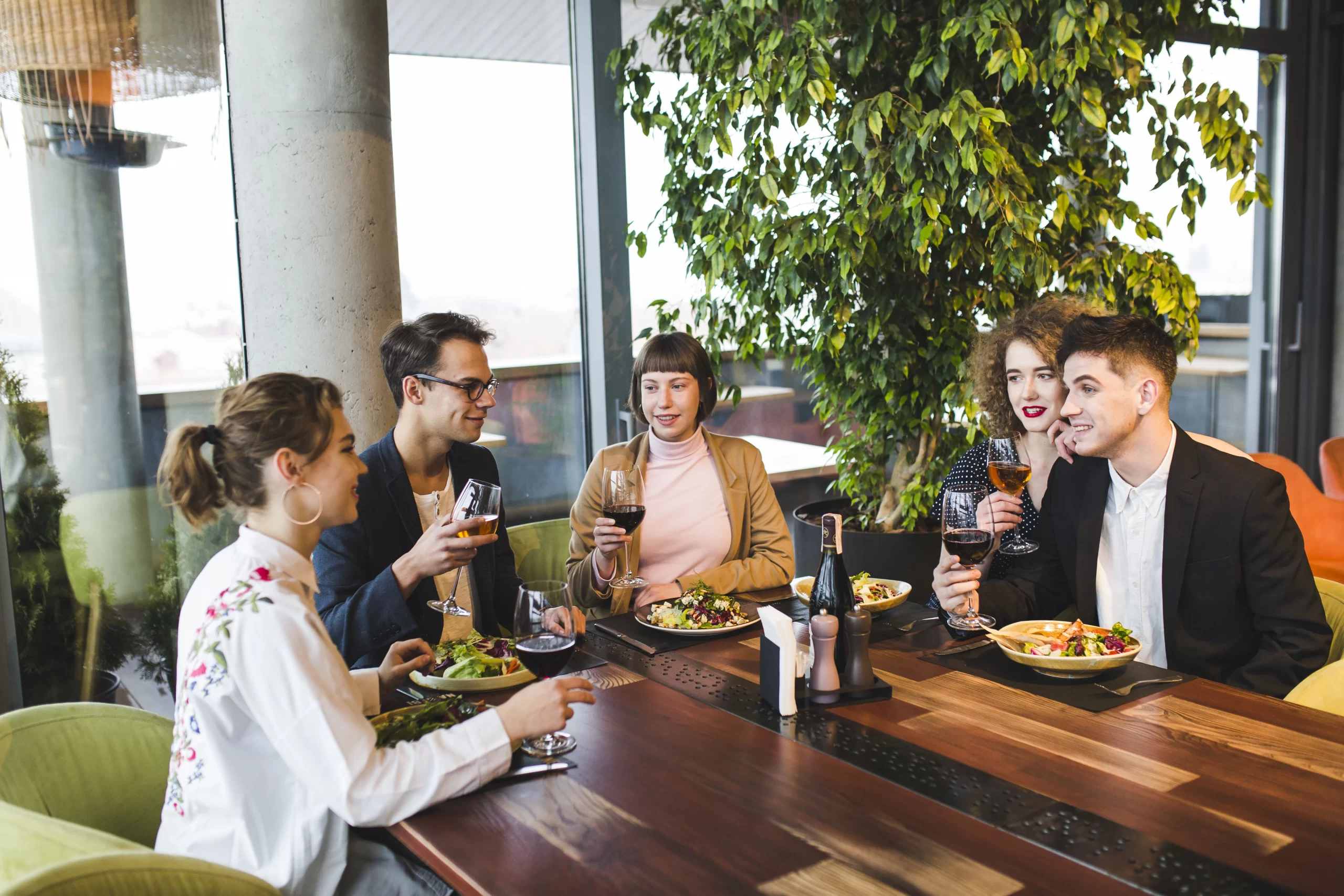 group of friends eating in restaurant - about layover