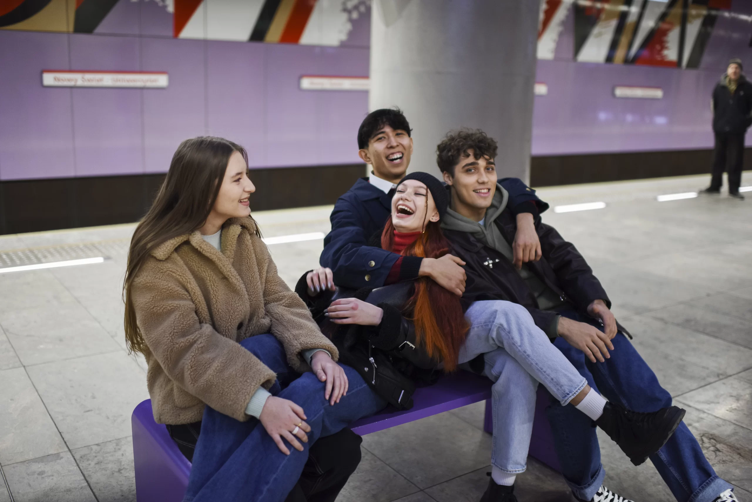 Happy teens sitting together - layover